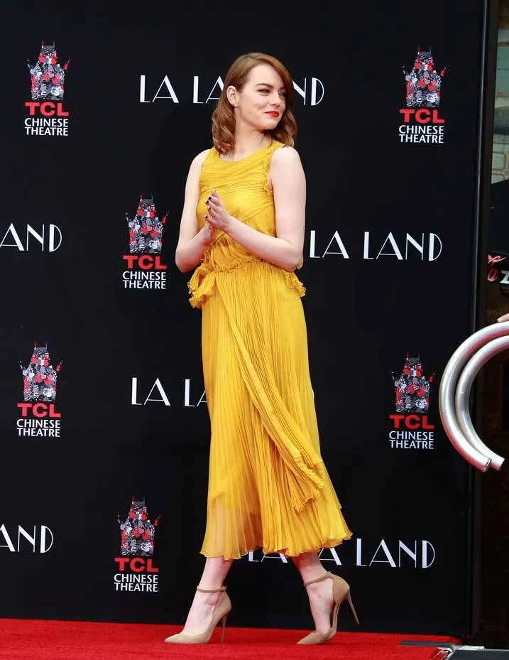 Emma Stone shows off her beautiful feet in high heels.